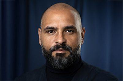 Imagem da notícia Imagem de rosto do palestrante Michel Alcoforado, homem branco, careca, de barba escura