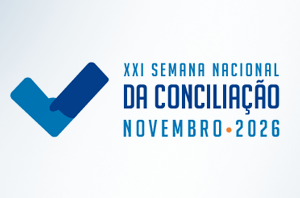 Imagem da Notícia Marca da XXI Semana Nacional da Conciliação - Novembro 2026, com o logotipo estilizado em formato de V formado por aperto de mãos